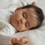 Why Do Babies Sleep With Their Arms Up photo